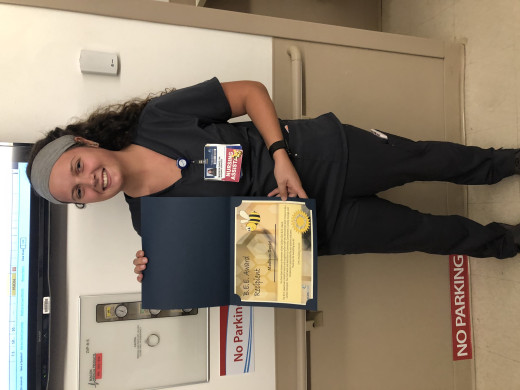 Madison David with her Bee Award certificate
