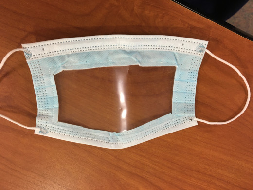 Staff masks to assist hearing impaired patients who are lip readers.