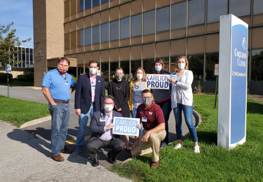 Members of our MarCom team recognize our clinical colleagues on Oct. 1, 2021, in front of the 213 McClanahan building.