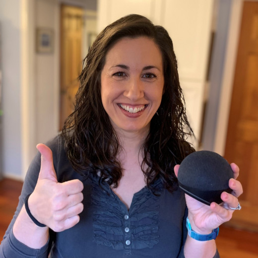 Therapist holding Amazon Echo Speaker