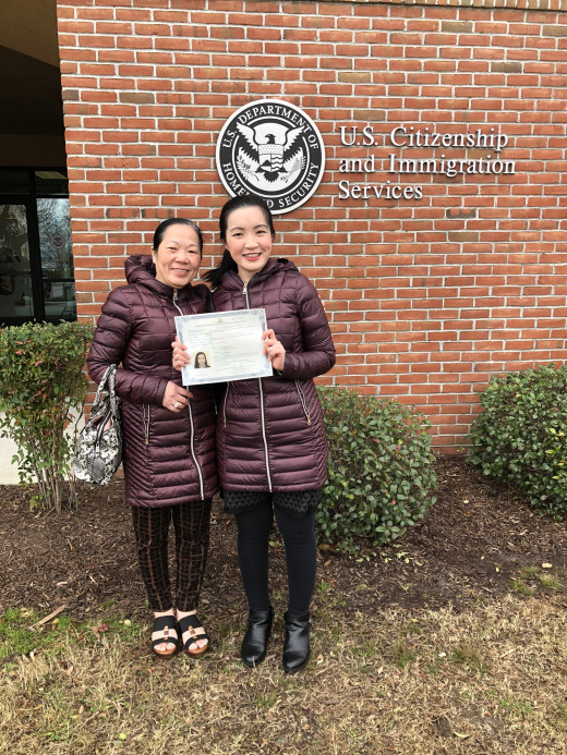 Thanh and her mother outside the DUnited States Citizenship and Immigration Service field office in Norfolk, just after receiving her certificate.
