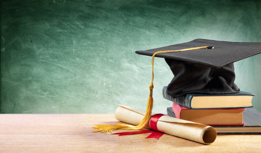 Graduation cap on top of a stack of books