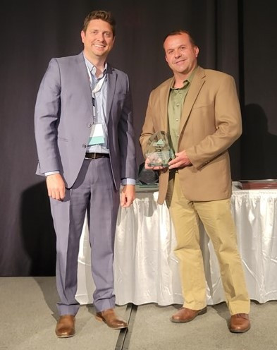 Craig Bryant accepting award on behalf of the team