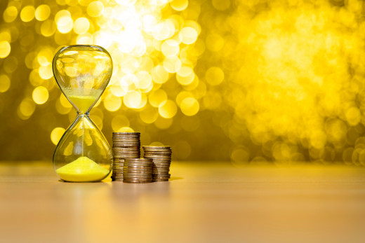 hour glass and coins picture
