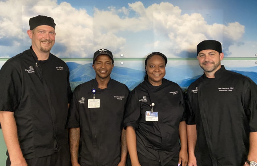 Pictured from left to right: Matt davidson, Catering Manager, Brandon Hairston,Head Cook, Danesha Anderson-Pride, Head Cook, and Executive Chef, Sam Lazzaro