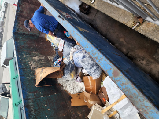 maintenance in the dumpster trying to get them out