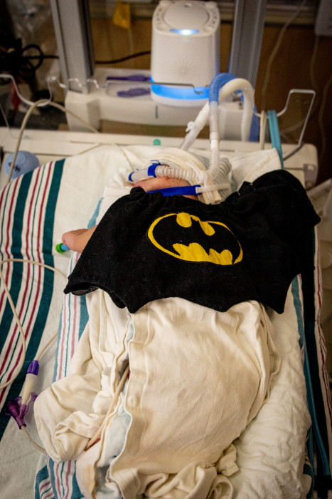 NICU patient dressed up as Batman for Halloween