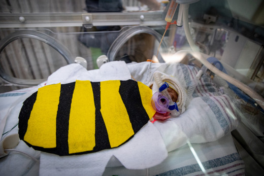 NICU patient dressed up as a bee for Halloween