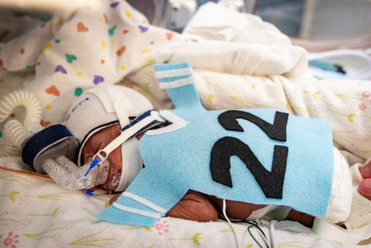 NICU patient dressed up as a sports player for Halloween