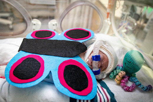 NICU patient dressed up as a butterfly for Halloween