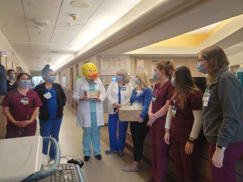 CNRV Infection Control presents the Golden Bathtub Award and goodies to staff. 