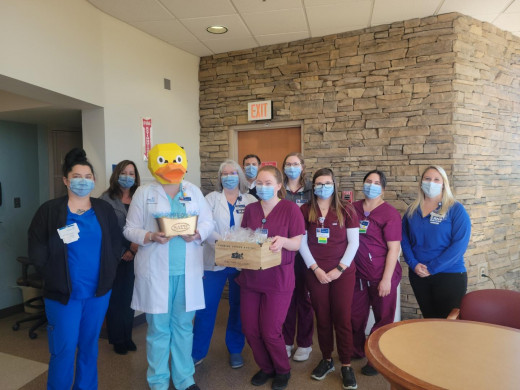 CNRV Surgical Care Unit poses with th Golden Bathtub Award.