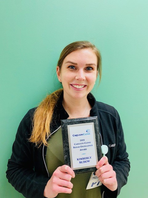 Kimberly McDow shows off her Rehab Excellence Award for 2022