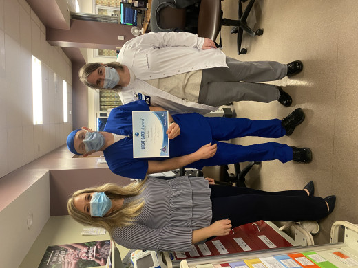 Alicia Bales, Senior Director and Kim Brown, Nursing Unit Manager present a Great Catch Award to Larry Rose, RN 