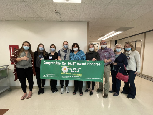 Claire Hansel with 9MICU Unit and Family