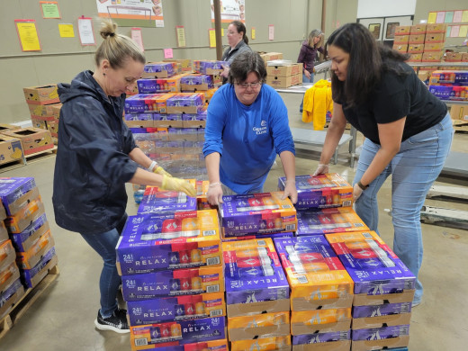 Leslie Wyatt, Sherry Hartsel, and Cara Basham loading waters onto a pallet