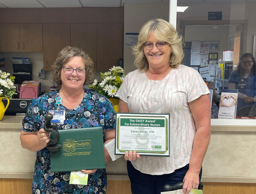 Deneen Davis (L) and Karen Jones (R) receiving their Daisy Awards