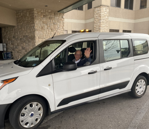 Ed Gravely eases the parking burden by driving the shuttle