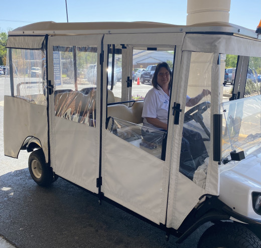 Trish on her golf cart