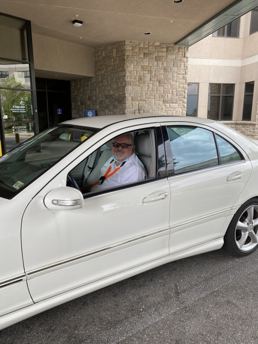 Mike Kirkner delivers a visitors car from the valet parking area