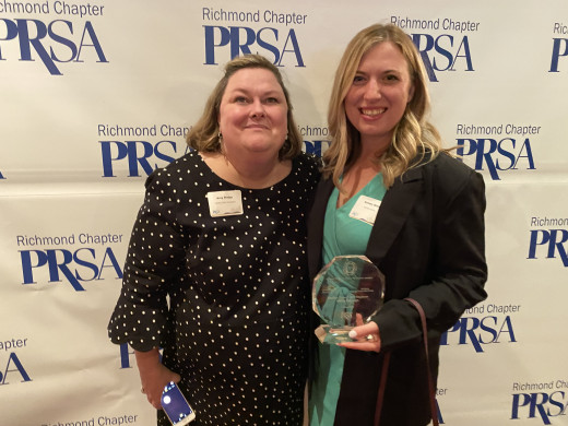 Amy Bridge (Foundation) and Kelsey Sims (MarCom) with their Award of Merit