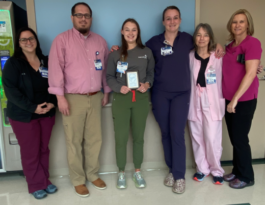 Peyton Smith RN (center) with 10MPCU Nursing leaders 