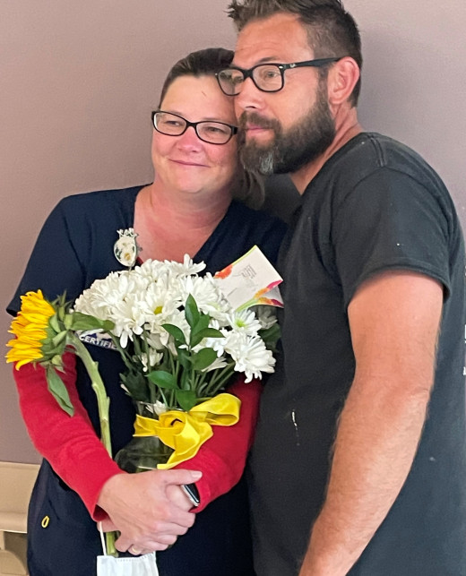 April Overfelt with her Husband at her DAISY Celebration