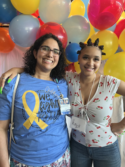 Dr. Borowicz Smiling with Childhood Cancer Survivor
