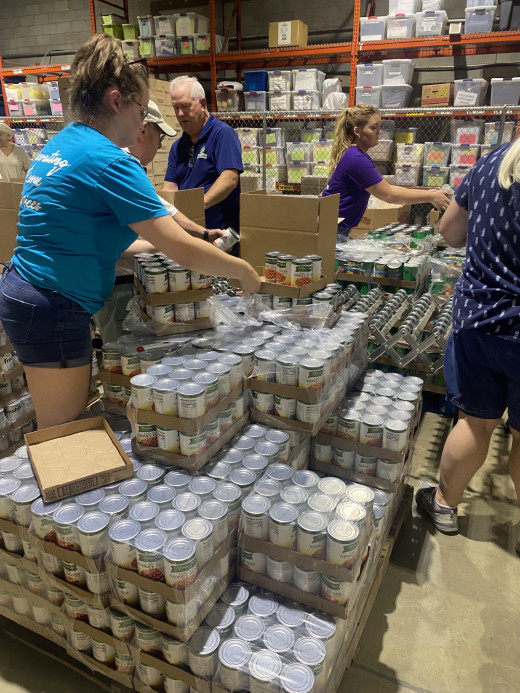 4 South PACU Team packing food for senior boxes at Feeding Southwest Virginia 
