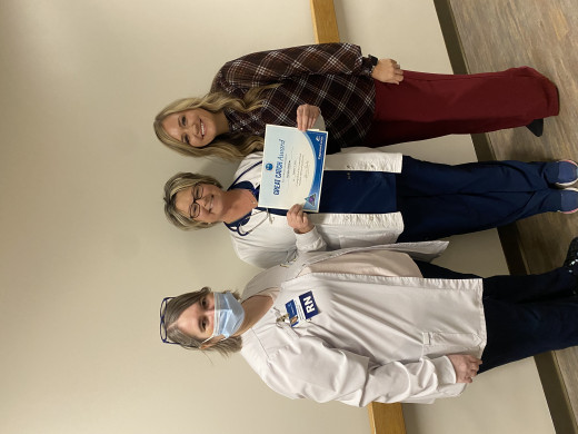 Deidra Stiltner received the Great Catch Award from Kim Brown, Unit Manager and Alicia Bales, Senior Director