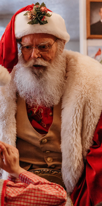 Santa visits with a pediatric hospice patient
