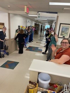 10 MTN staff gathered to wish patient farewell as she left!