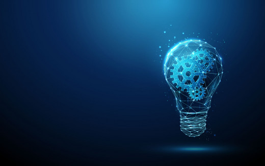 stylized stock image of light bulb with mechanical cogs indicating innovation
