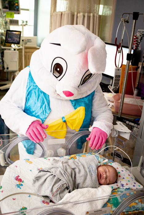 Easter bunny visits with pediatric patients