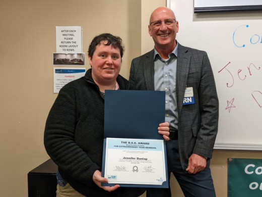Jen with Tom Miller, senior director and member of the Ambulatory Recognition Council (ARC), as he presents her certificate.