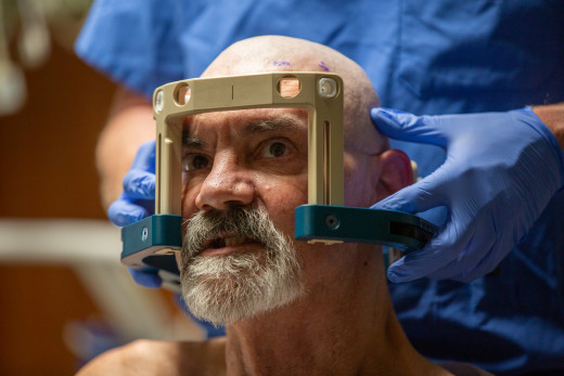 The focused ultrasound equipment is carefully fitted on the patient.