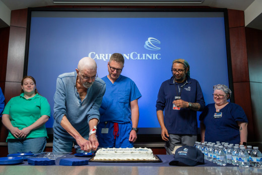 Dr. Witcher and team celebrate the treatment outcome with the patient.
