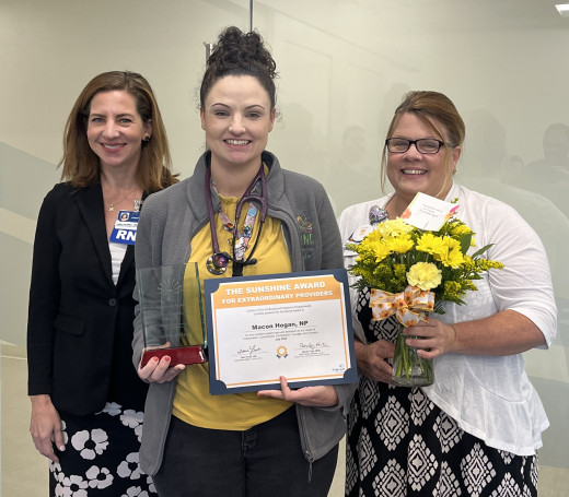 Macon Hogan with her leaders Jane Colwell and Heather Kissner