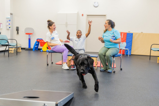 Wali assisting a patient in physical therapy