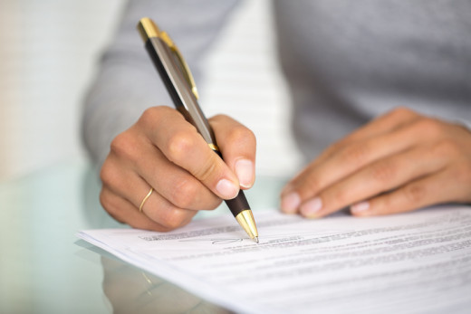 woman signing a form