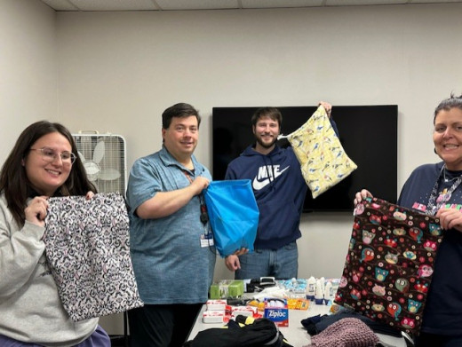 Team members packing bags.