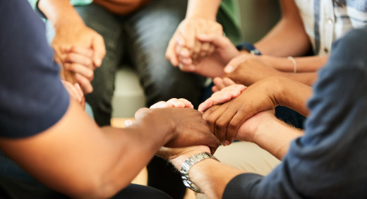 support group holding hands