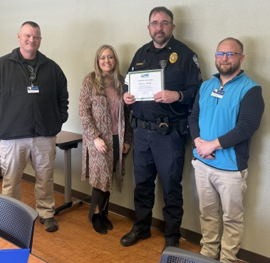 Sgt. Kevin White, Alicia Bales-Senior Director, Lt. Ed Hertling and Captain Paul King 