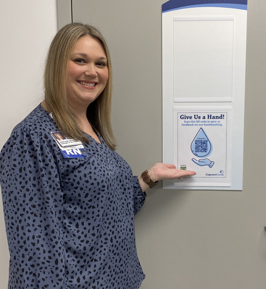 Carrie Daniel posing with the QR code poster:)