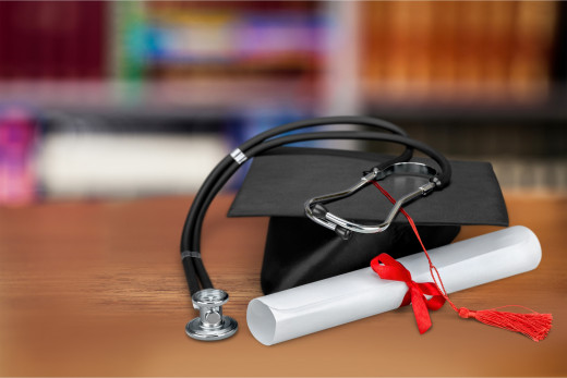 cap, gown and stethoscope