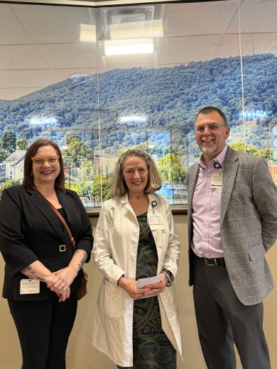 Meribeth Ingram and Rob Garbee present Dr. Dorsey with her prize