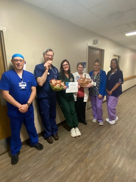 Carilion Tazewell Community Hospital team enjoying their cookies and HAI free certificate.