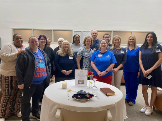 Some of our OAC members are pictured here around the Missing Man Table. 