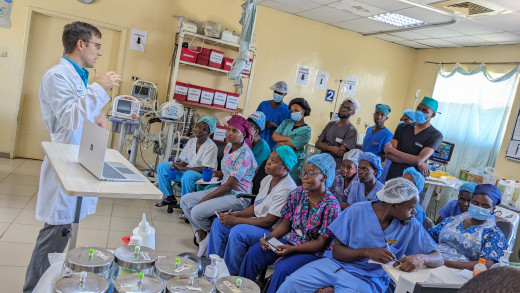 Dr. Joshua Stodghill performing medical outreach and education in Malawi, Africa
