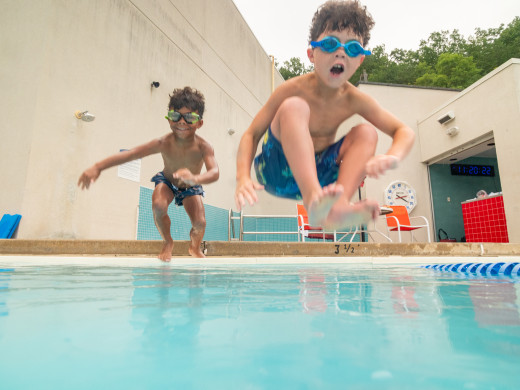 Kids jumping in pool
